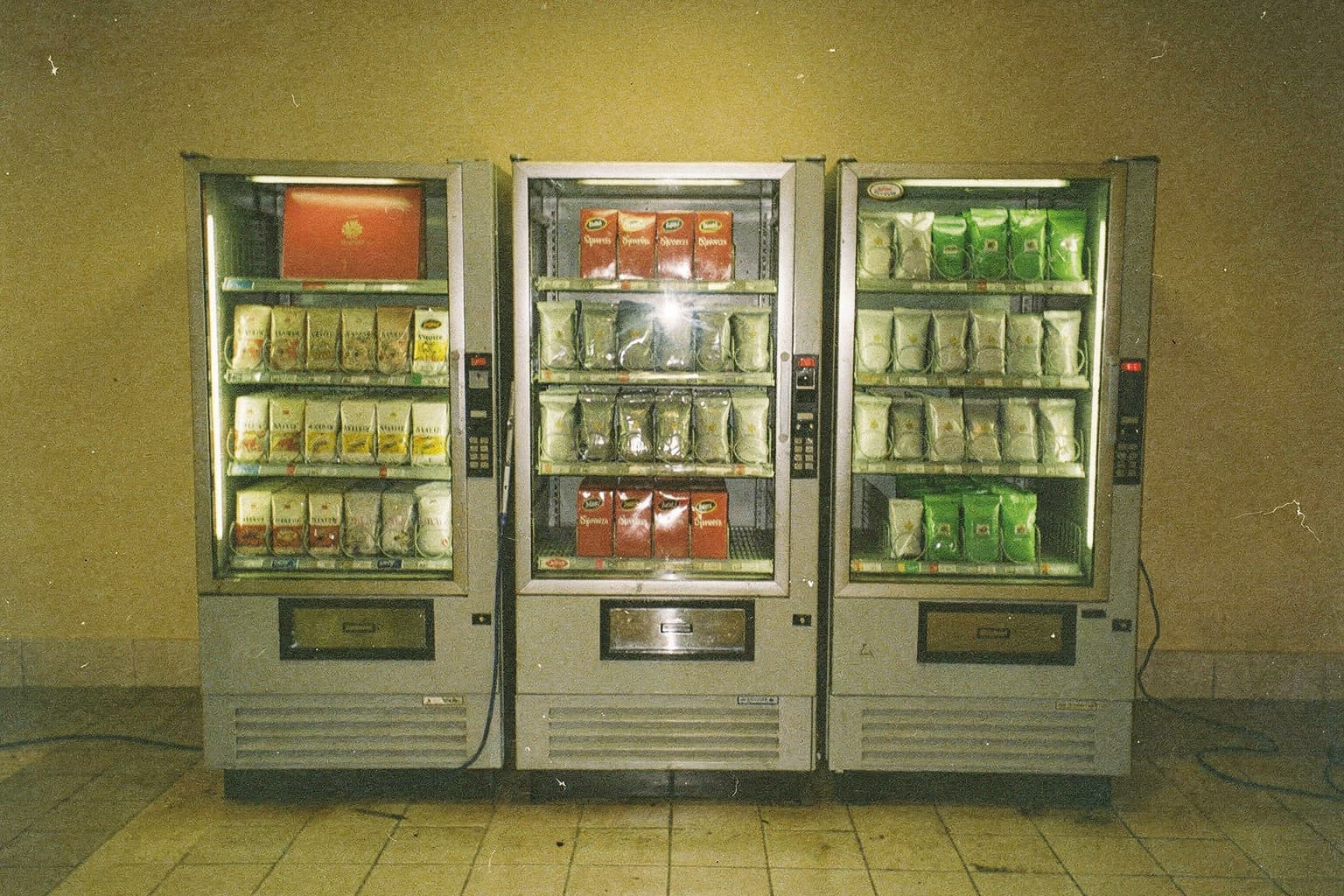 Three vending machines stocking the same red product differently