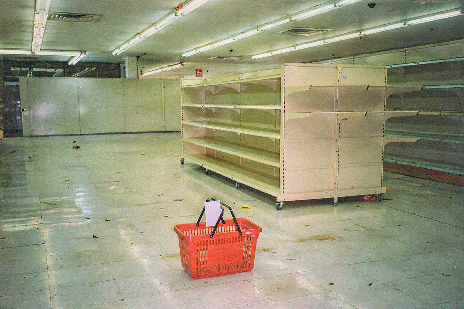 Movable store shelving assembled around the red shopping basket