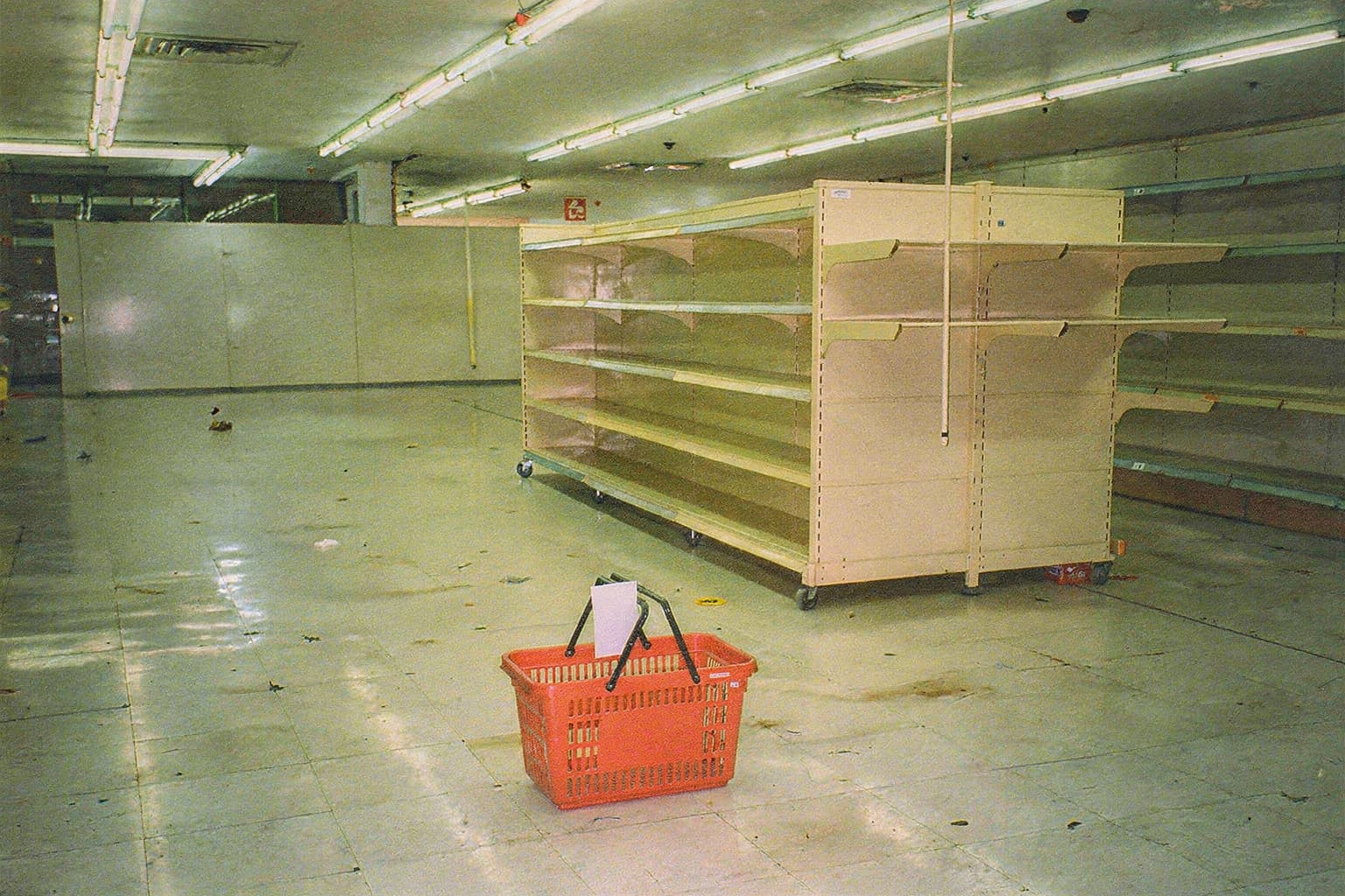 Movable store shelving assembled around the red shopping basket